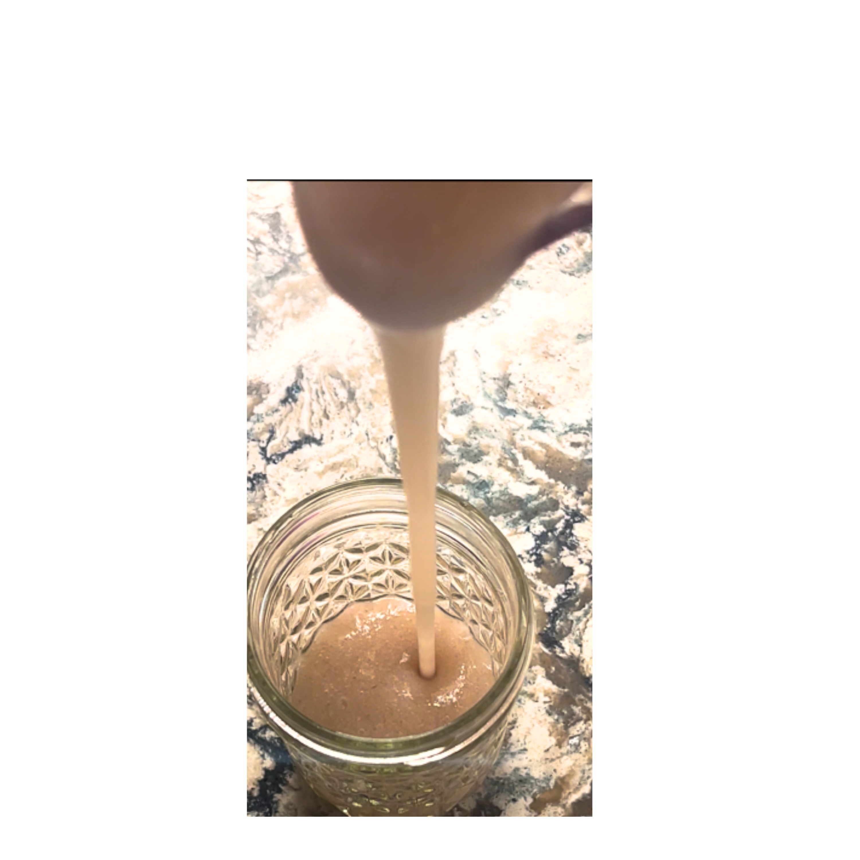 Sea Moss Gel being poured into container.